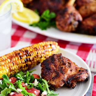 plate of easy lemon herb grilled chicken corn and salad