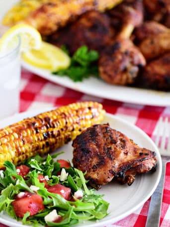 plate of easy lemon herb grilled chicken corn and salad