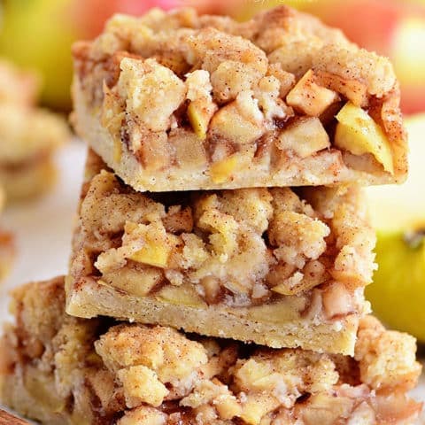 a stack of 3 apple pie bars with crumb topping