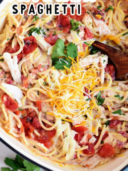 cheesy chicken spaghetti in a cast iron pot