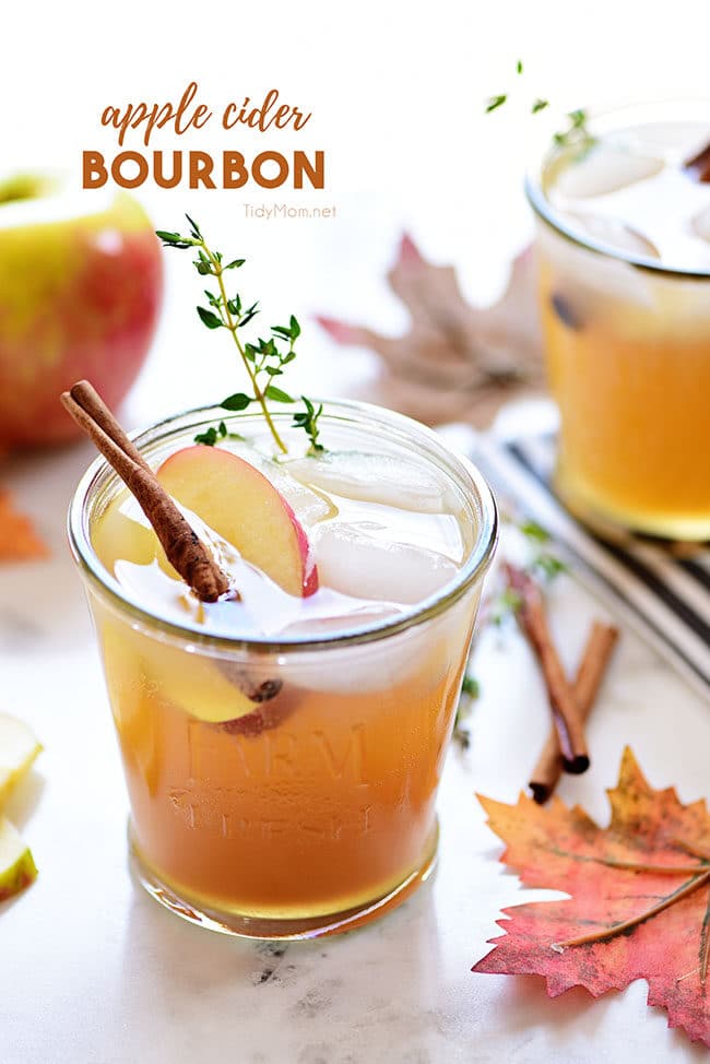 bourbon apple cider cocktail with thyme garnish