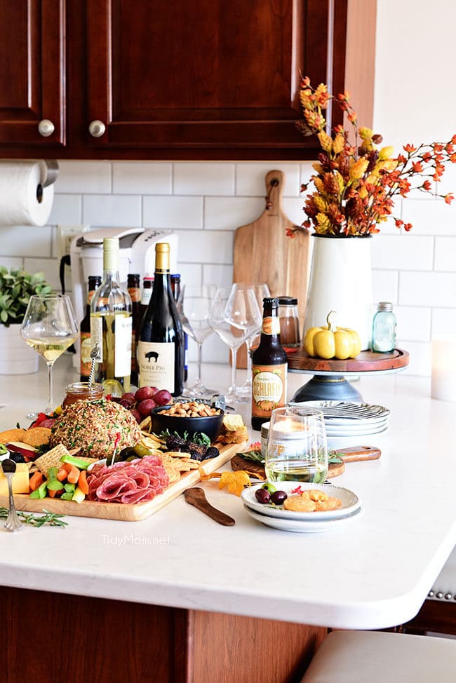 Fall Charcuterie Board on kitchen counter with wine