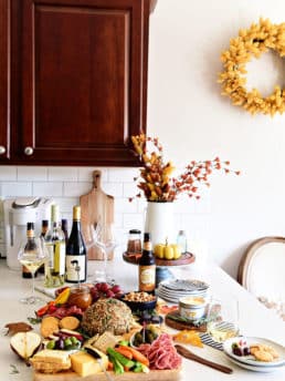 Fall Charcuterie Board in white kitchen with wine