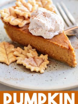 pumpkin pie with leaf cut-outs and cinnamon whipped cream