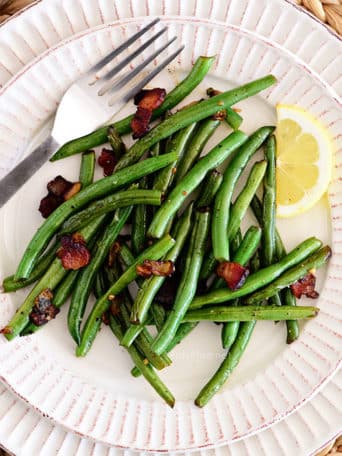 Sautéed Green Beans with bacon and lemon on a plate