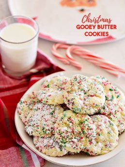 Christmas Gooey Butter Cookies on a plate with a glass of milk