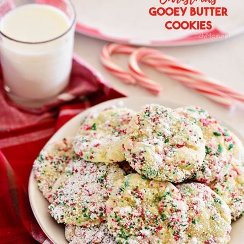 Christmas Gooey Butter Cookies on a plate with a glass of milk