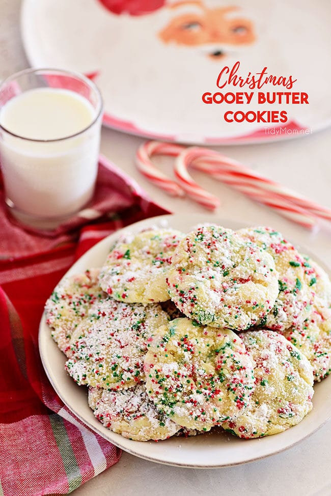 Christmas Gooey Butter Cookies on a plate with a glass of milk