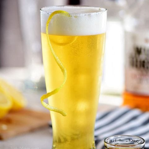 boilermaker beer cocktail with a lemon twist in a frosty glass