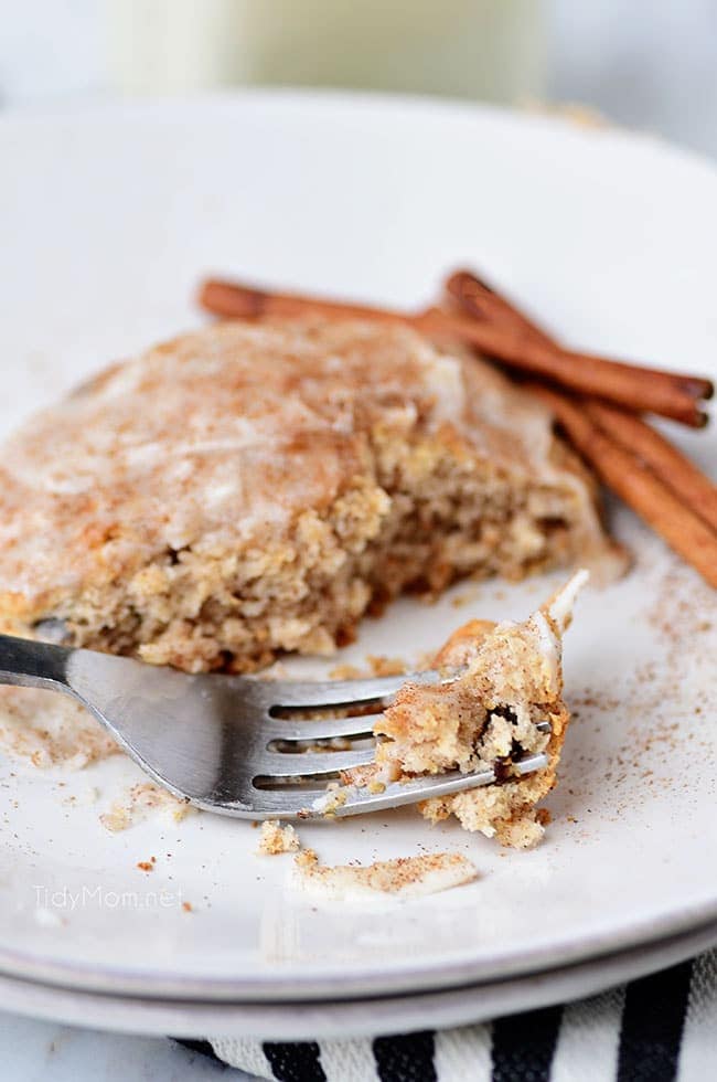 cinnamon raisin biscuit on a plate with a fork