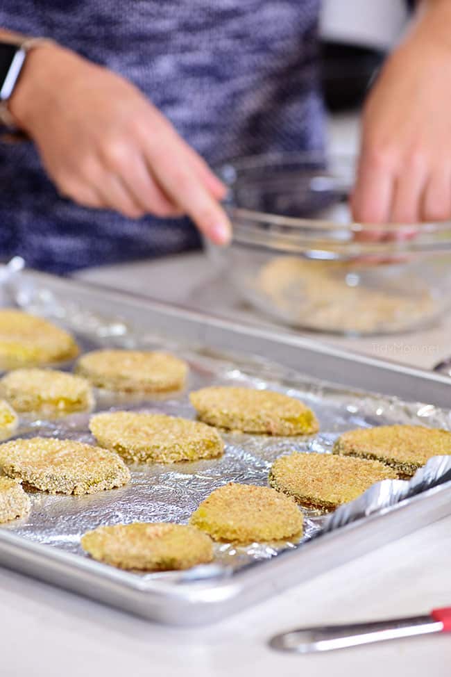 oven fried pickles on a pan ready for the oven