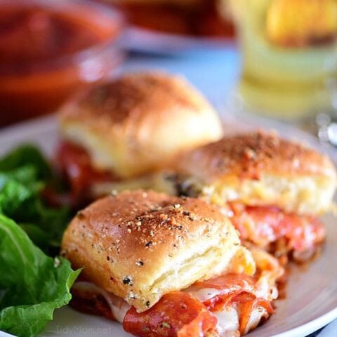 three cheesy pepperoni Pizza Sliders on a plate