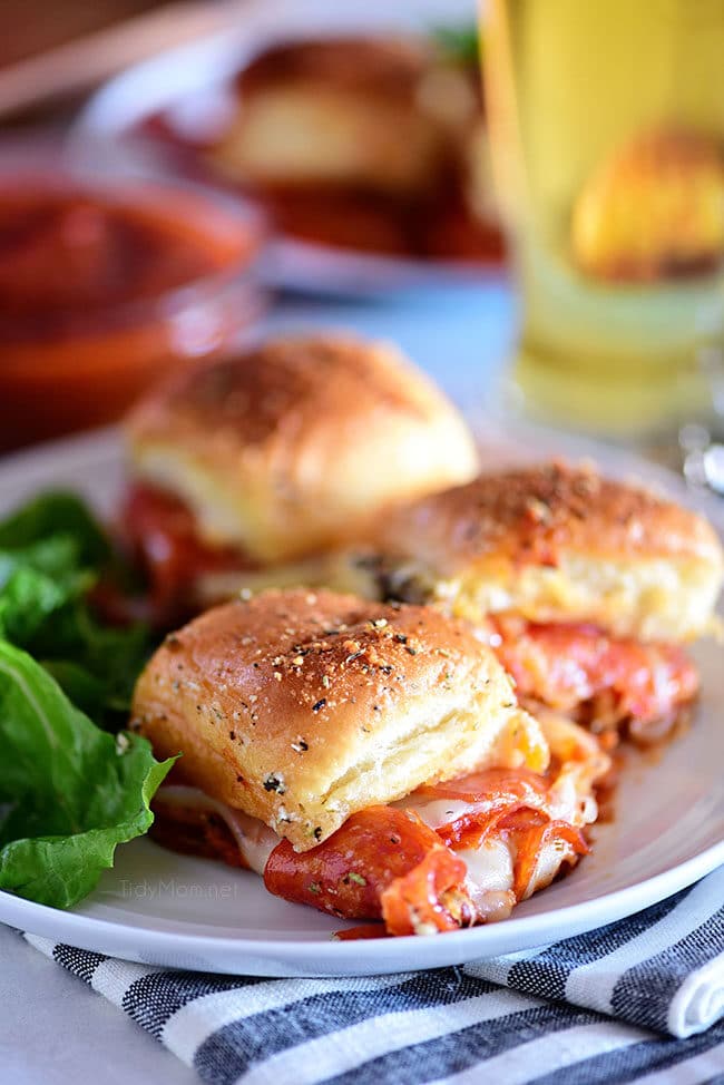 three cheesy pepperoni Pizza Sliders on a plate