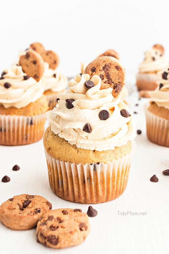 Cookie Dough Cupcakes with Cookie Dough Frosting garnished with a little cookie on top
