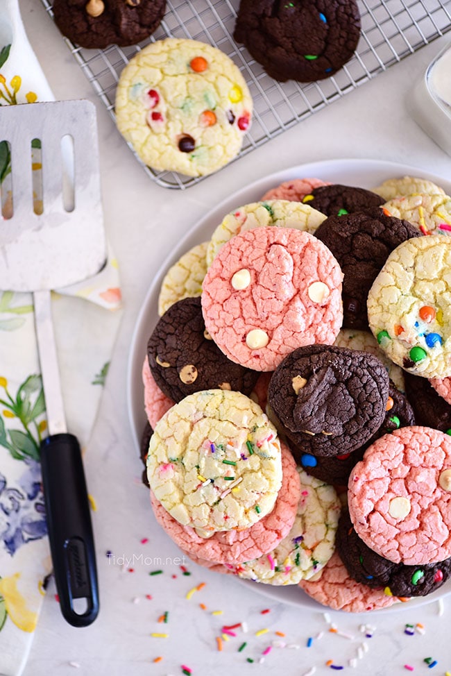 chocolate, vanilla and strawberry cookies stacked on plate