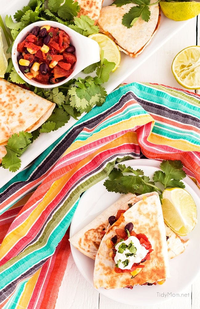 chicken quesadillas on a plate with colorful napkin