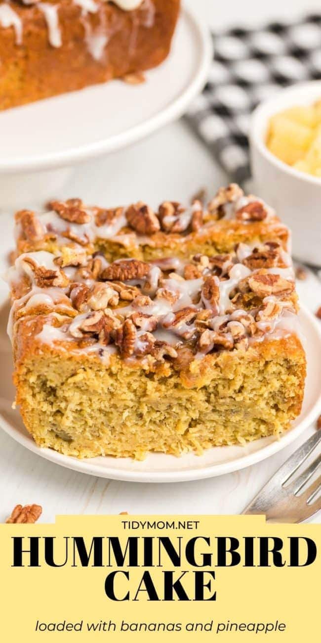 hummingbird cake slice with icing and pecans