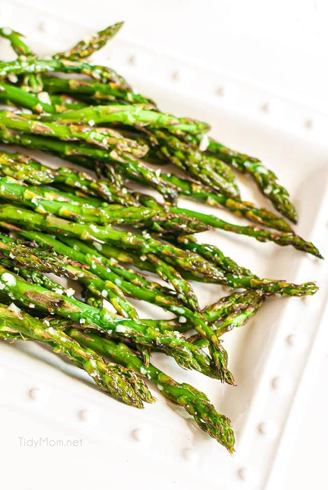 white plate with parmesan roasted asparagus