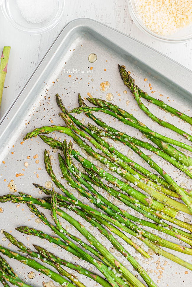  cooked asparagus on a baking sheet