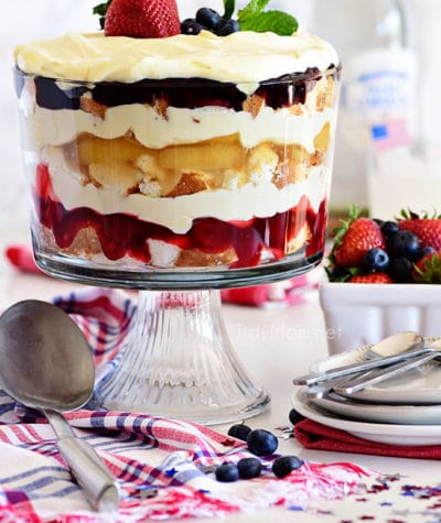 Red white and blue fruit trifle layered dessert in glass bowl