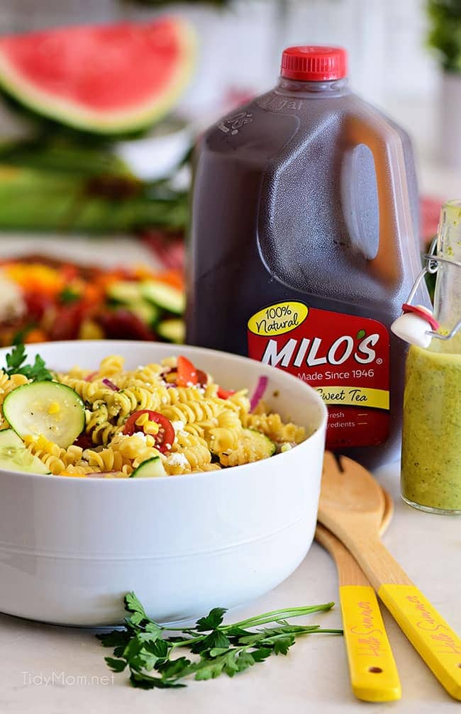 summer pasta salad next to a jug of sweet tea