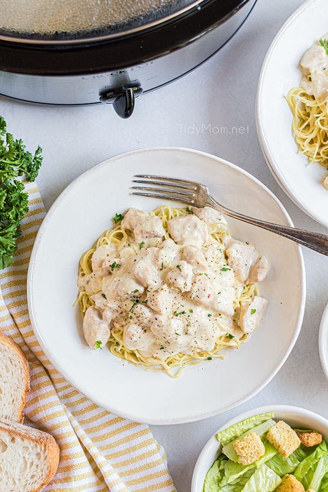 creamy chicken on a plate of pasta