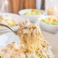 creamy chicken and pasta on a fork