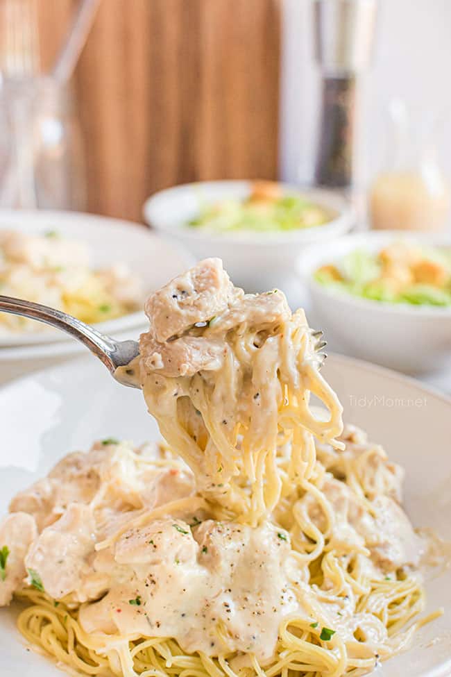 creamy chicken and pasta on a fork