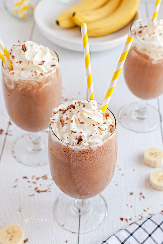 milkshakes with whipped cream and yellow straws