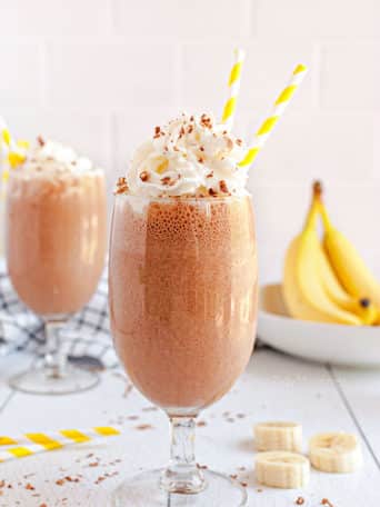 milkshakes with yellow straws and bananas