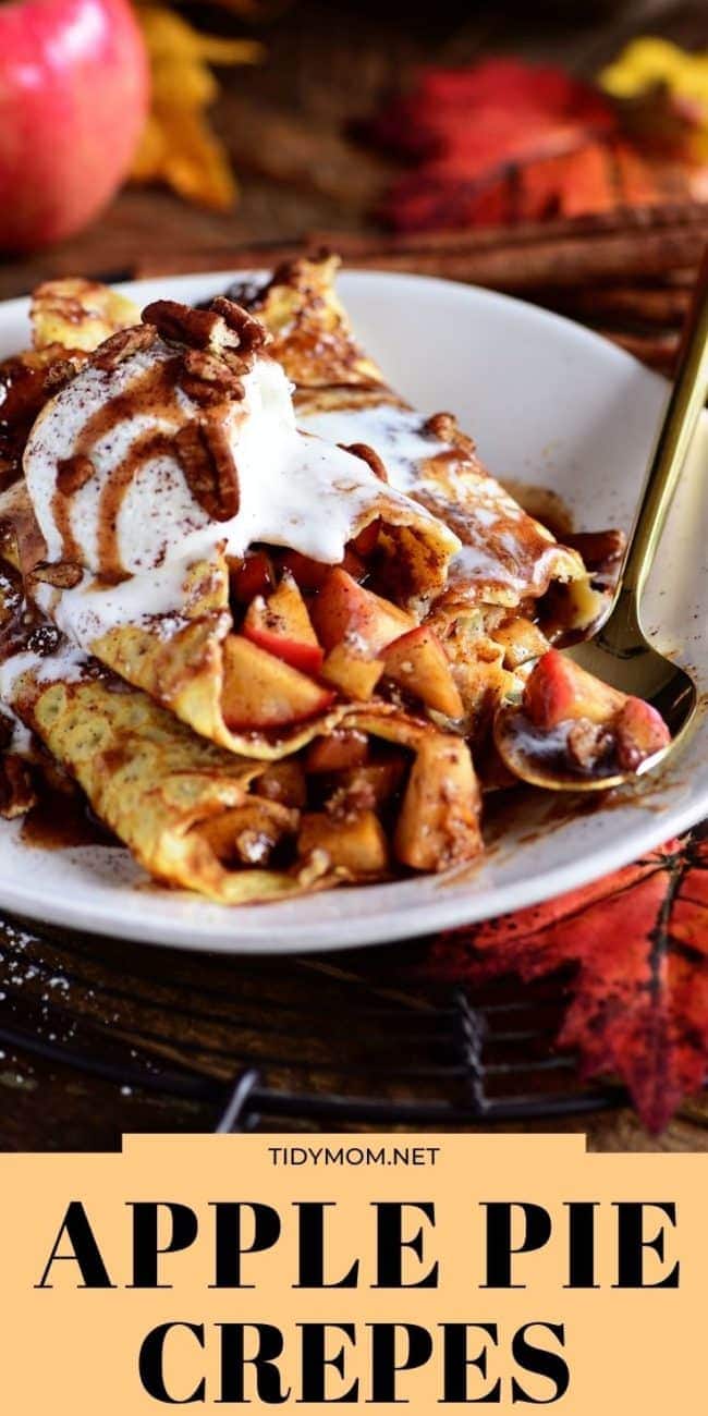 a stack of apple crepes with apples in the background