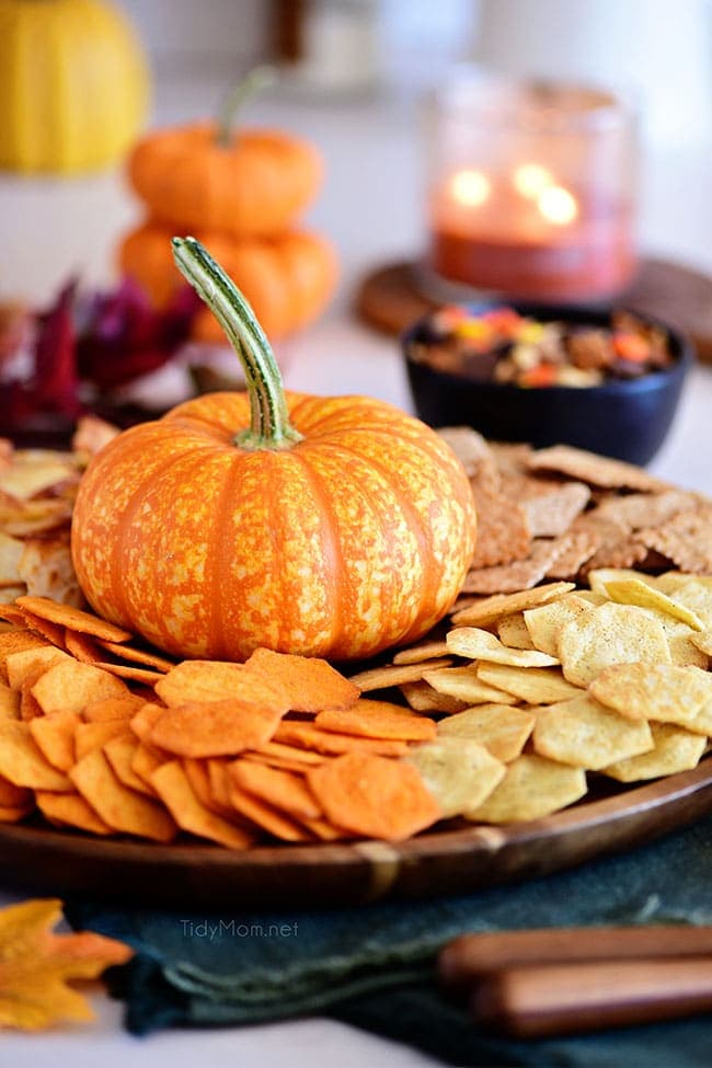 round tray with chips and a pumpkin