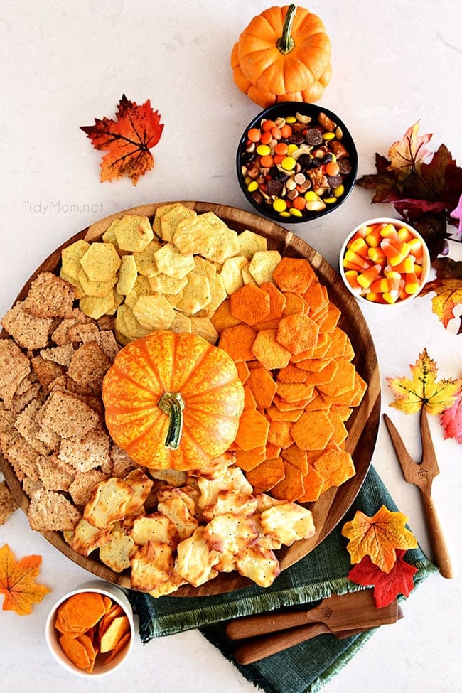 round tray with crackers and a pumpkin