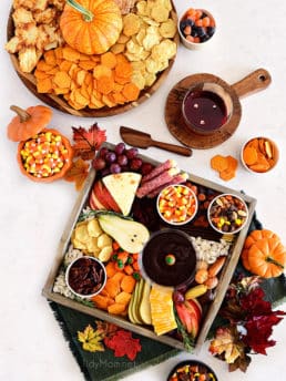 2 fall themed snack boards with sweet and salty treats
