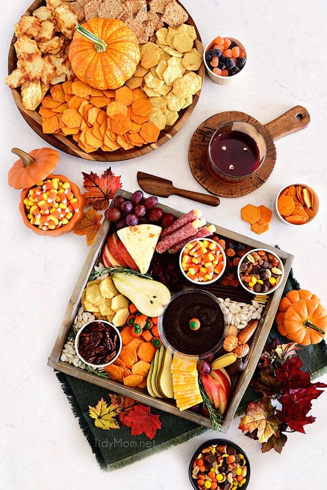 2 fall themed snack boards with sweet and salty treats