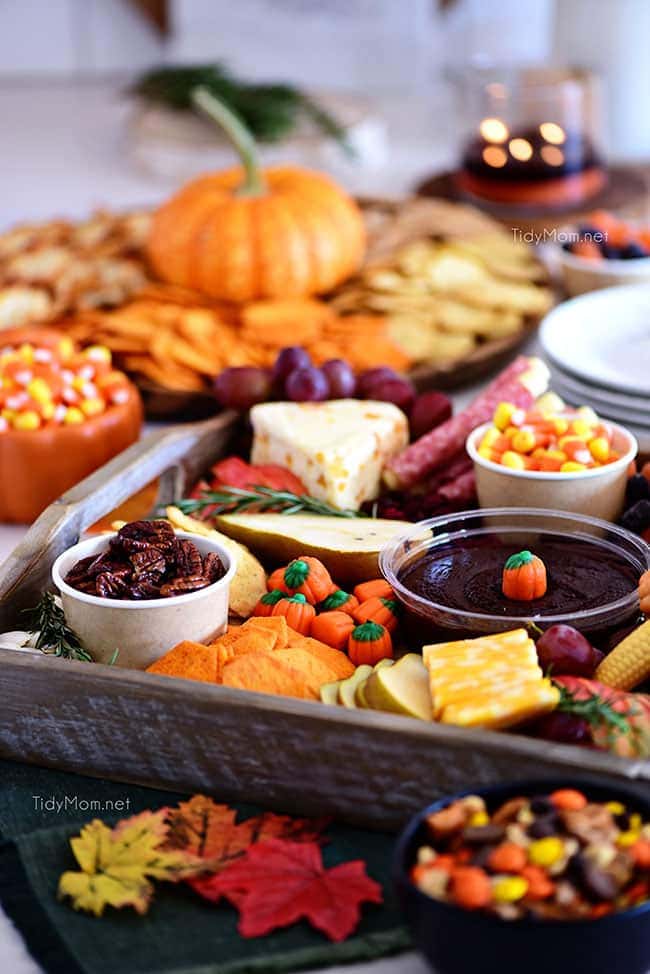 fall themed snack board with a variety of treats