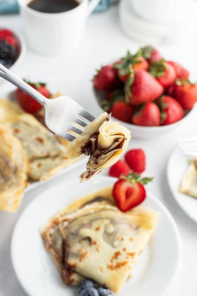 a bite of nutella crepes on a fork