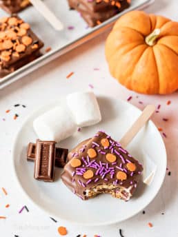 s'mores pop with halloween sprinkles on a plate