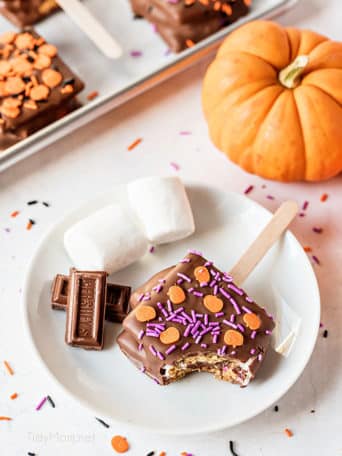 s'mores pop with halloween sprinkles on a plate