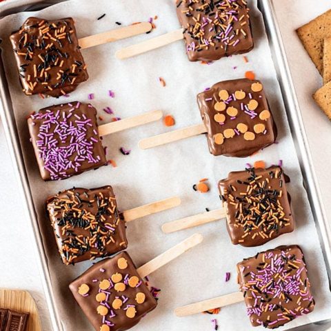 s'mores pops with halloween sprinkles on a pan