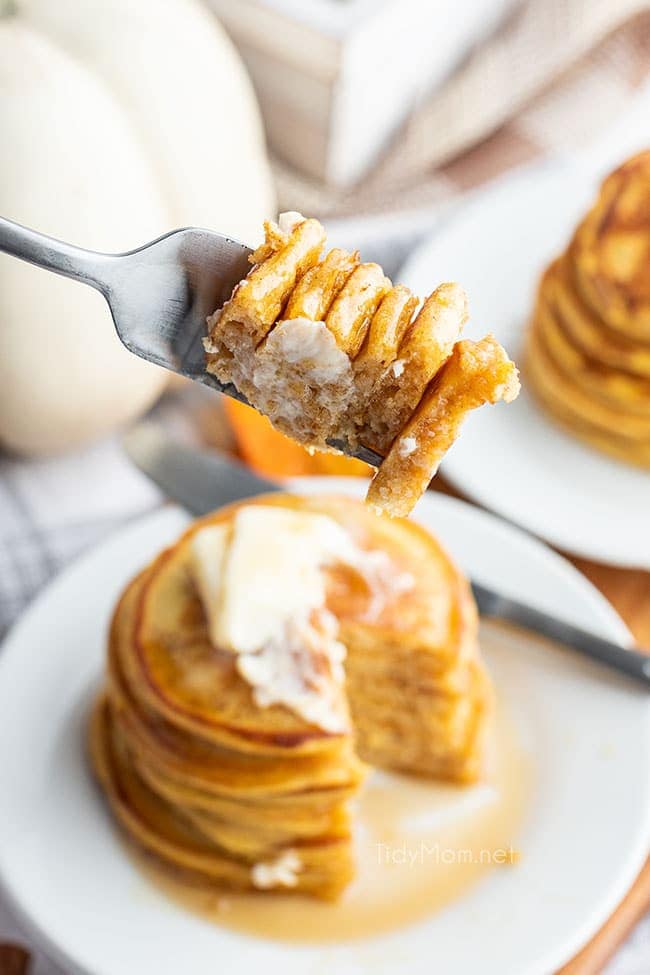 a bite of pancakes on a fork