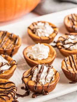 crustless mini pumpkin pies on a white platter