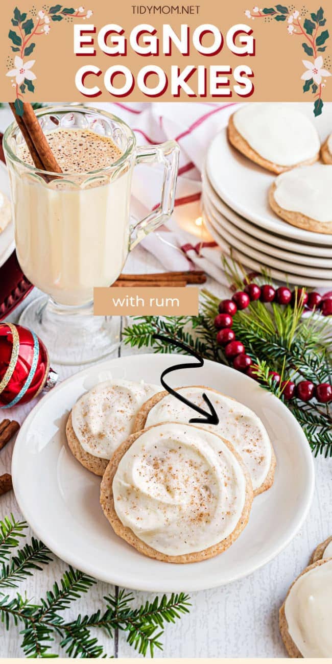 glass of eggnog with frosted cookies on a plate