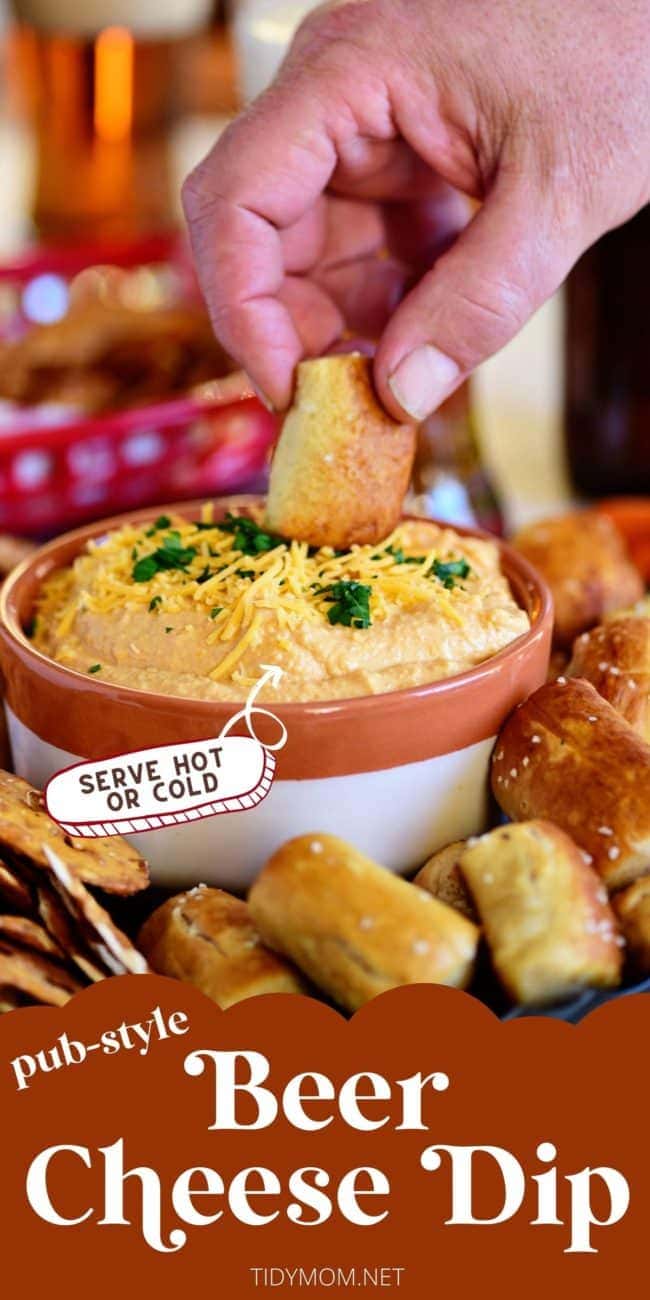 dipping pretzel into a bowl of beer cheese dip