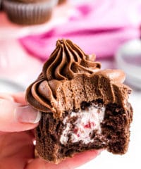 bite out of chocolate cupcake with creamy filling