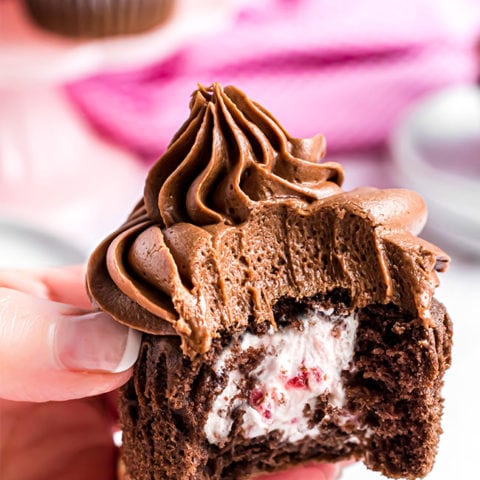 bite out of chocolate cupcake with creamy filling