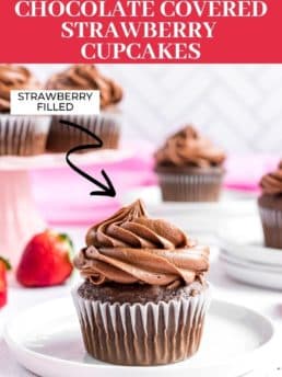 chocolate cupcakes on plates with strawberries