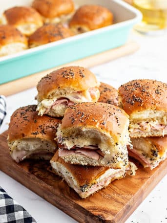 sliders on a wood tray with black check napkin