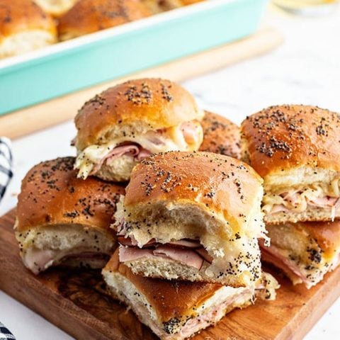 sliders on a wood tray with black check napkin