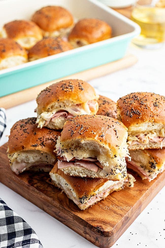 sliders on a wood tray with black check napkin